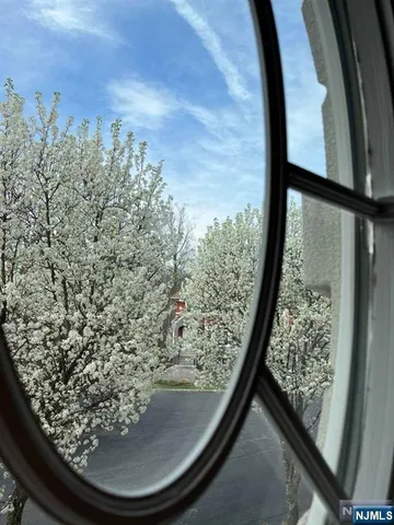 a spacious bathroom with a granite countertop tub sink and mirror