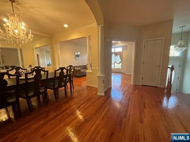 a large room with lots of furniture and wooden floor
