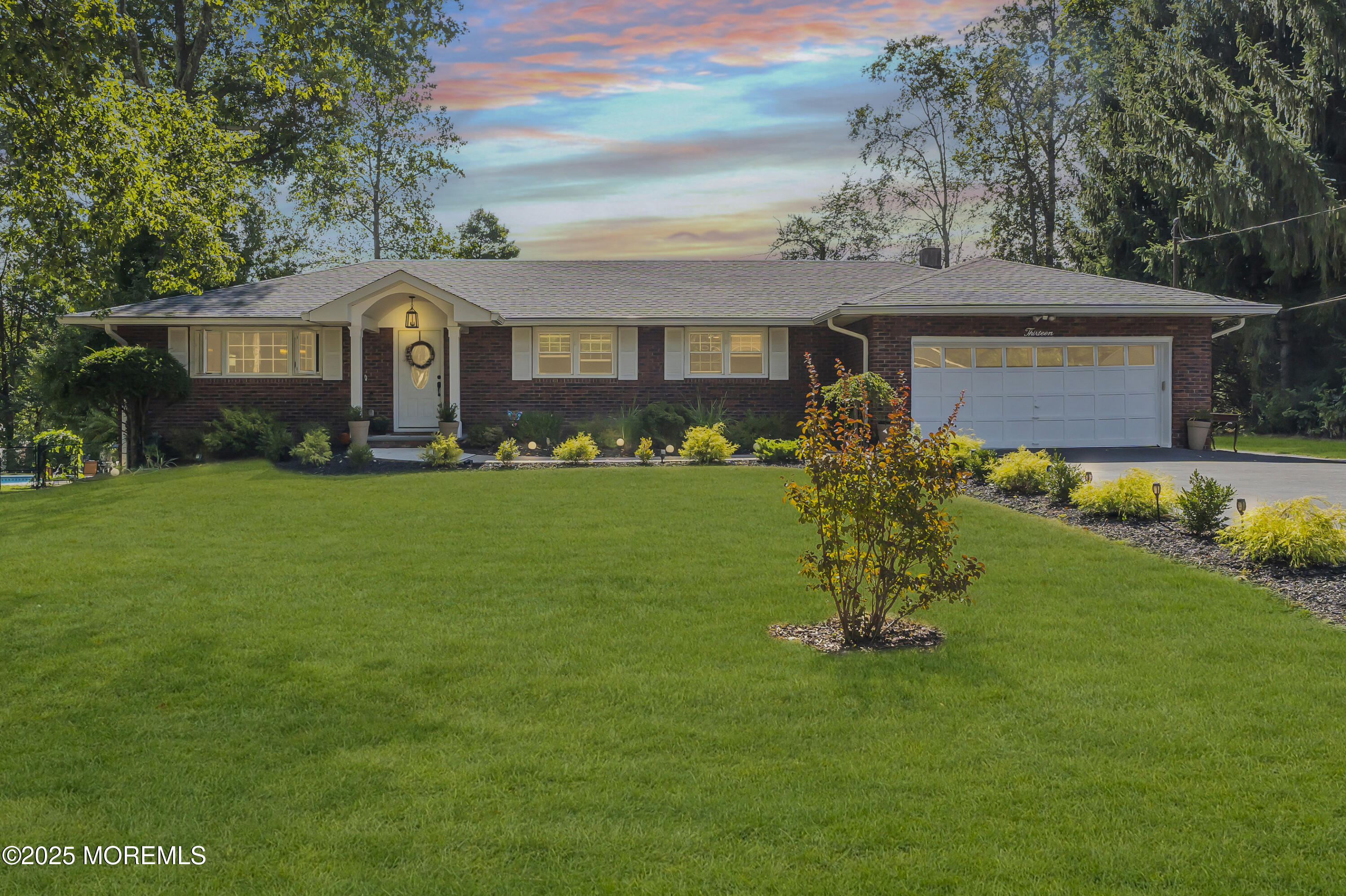 a front view of house with yard and green space
