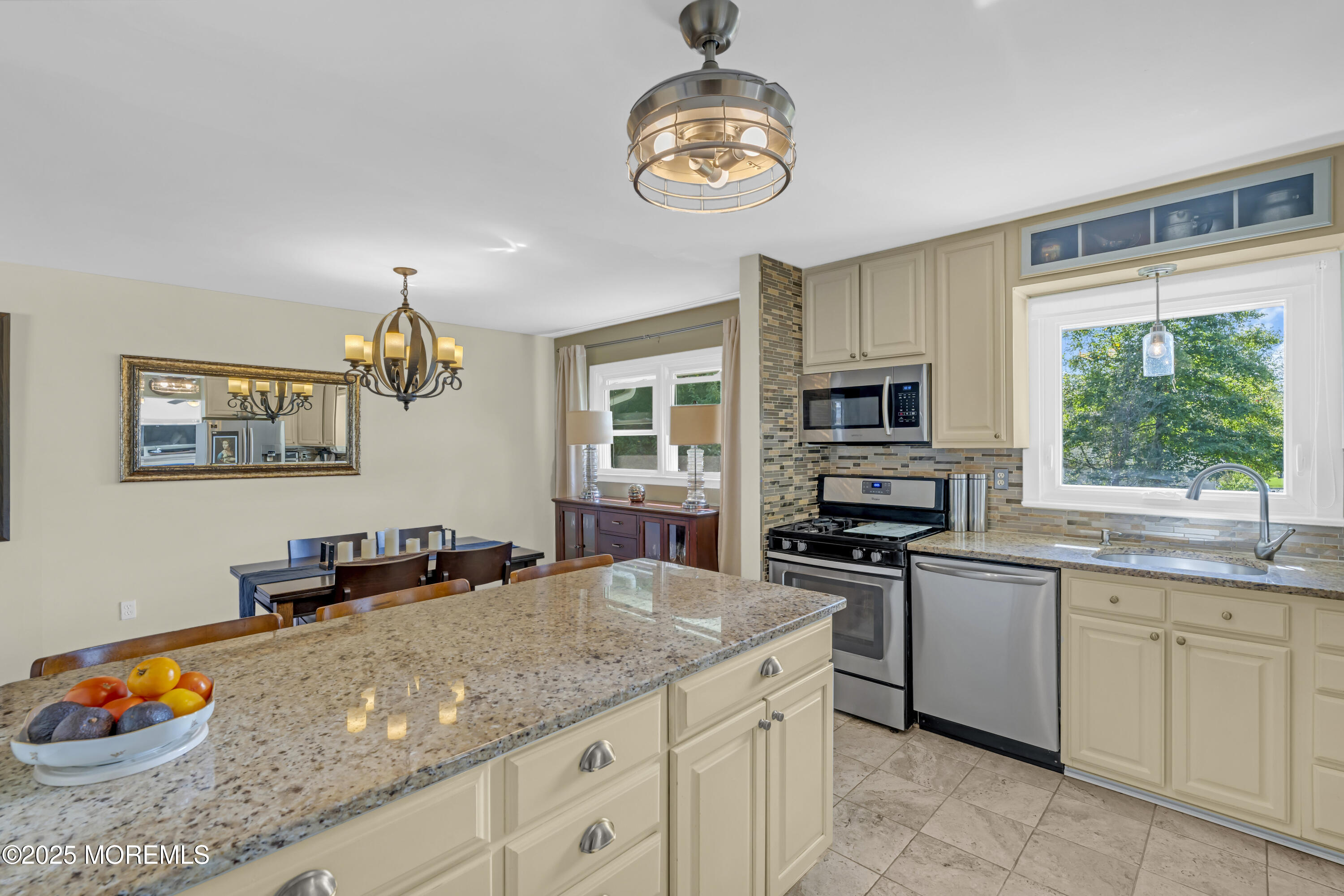 13 Mountview Road Morris Plains, NJ 07950 - Photo 15 of 59 a kitchen with stainless steel appliances granite countertop a stove top oven a sink dishwasher a dining table and chairs with wooden floor