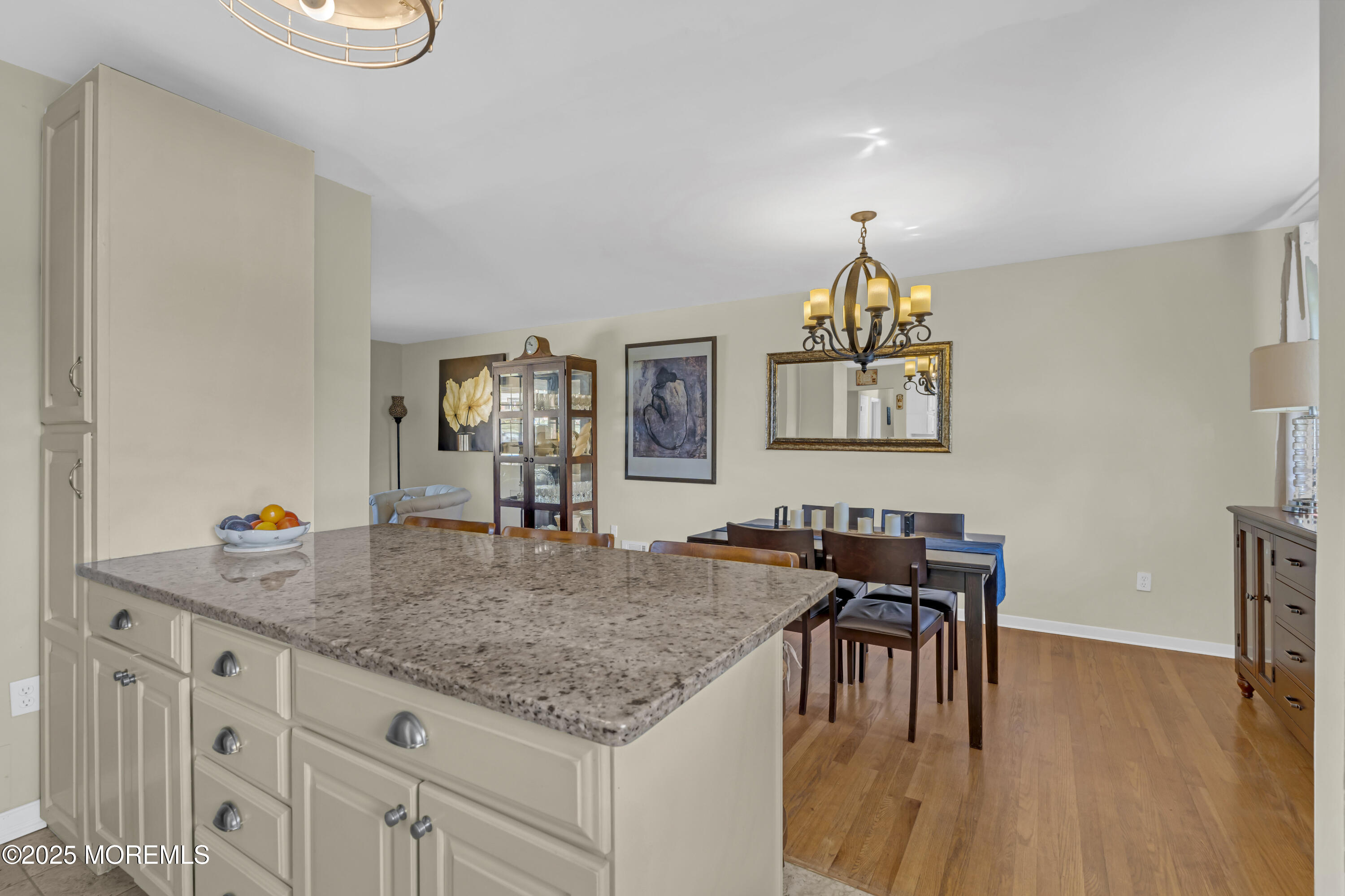 13 Mountview Road Morris Plains, NJ 07950 - Photo 16 of 59 a kitchen with granite countertop a table and chairs in it