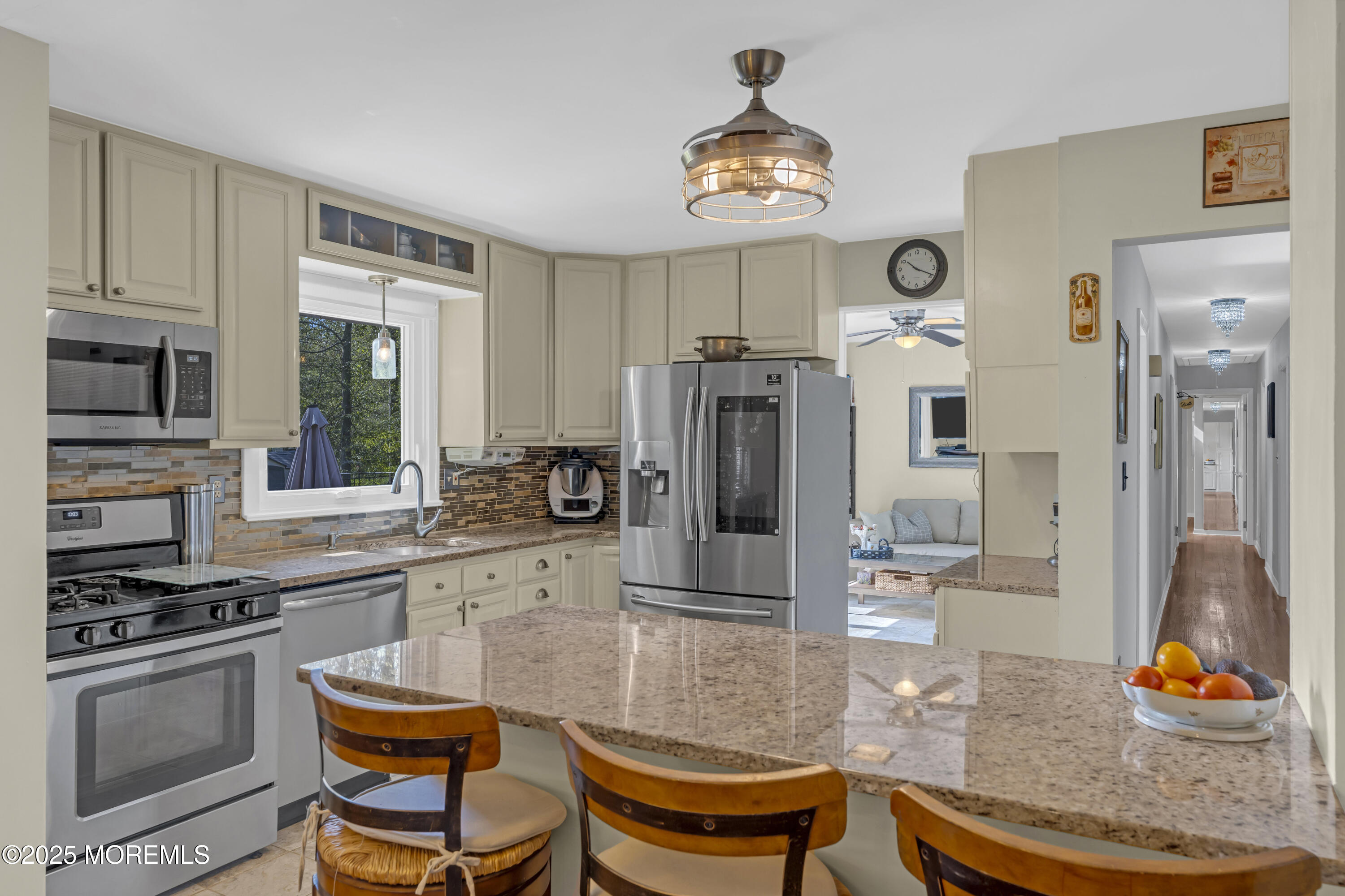 13 Mountview Road Morris Plains, NJ 07950 - Photo 19 of 59 a kitchen with stainless steel appliances kitchen island granite countertop a stove and a refrigerator