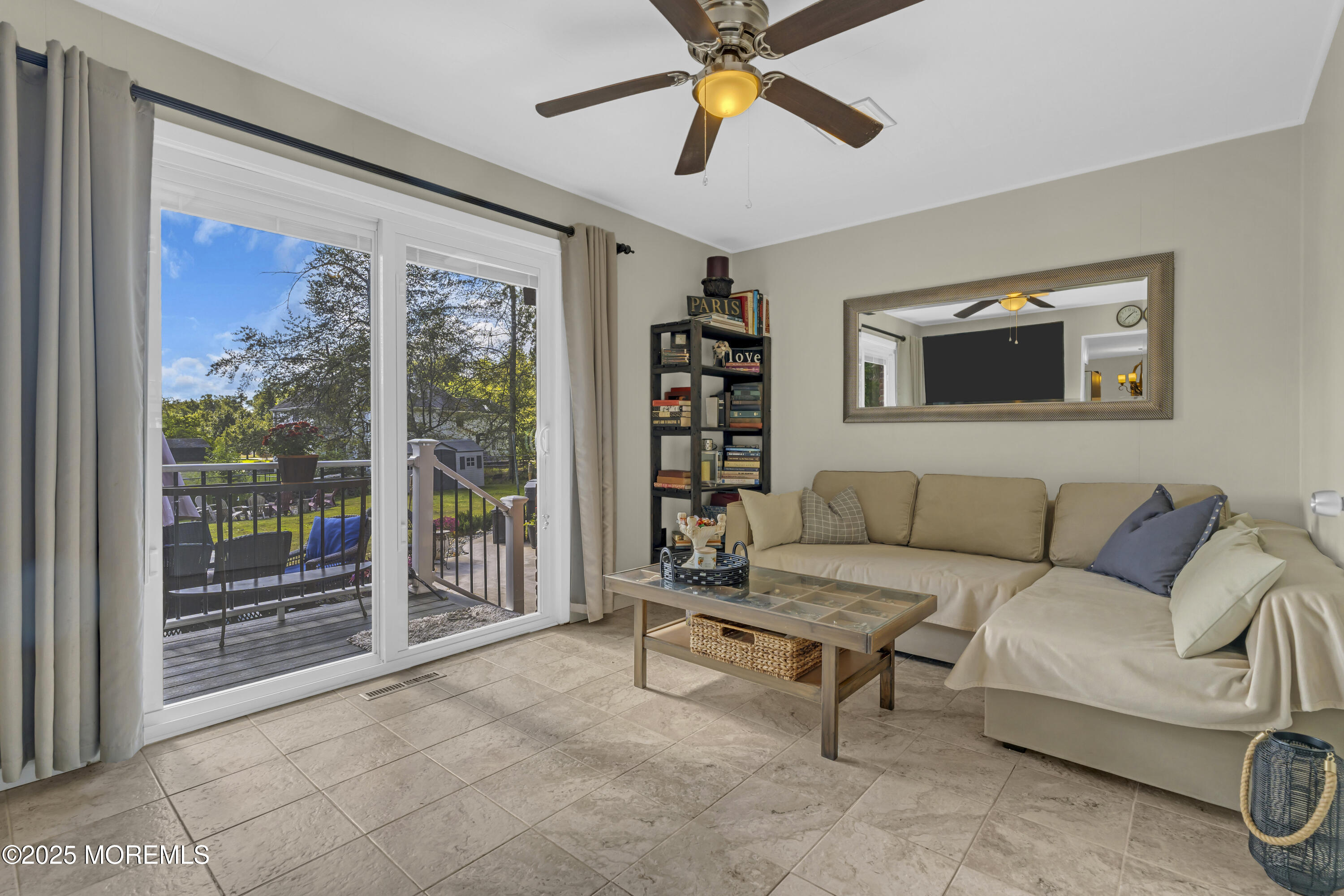 13 Mountview Road Morris Plains, NJ 07950 - Photo 21 of 59 a living room with furniture a ceiling fan and a large window