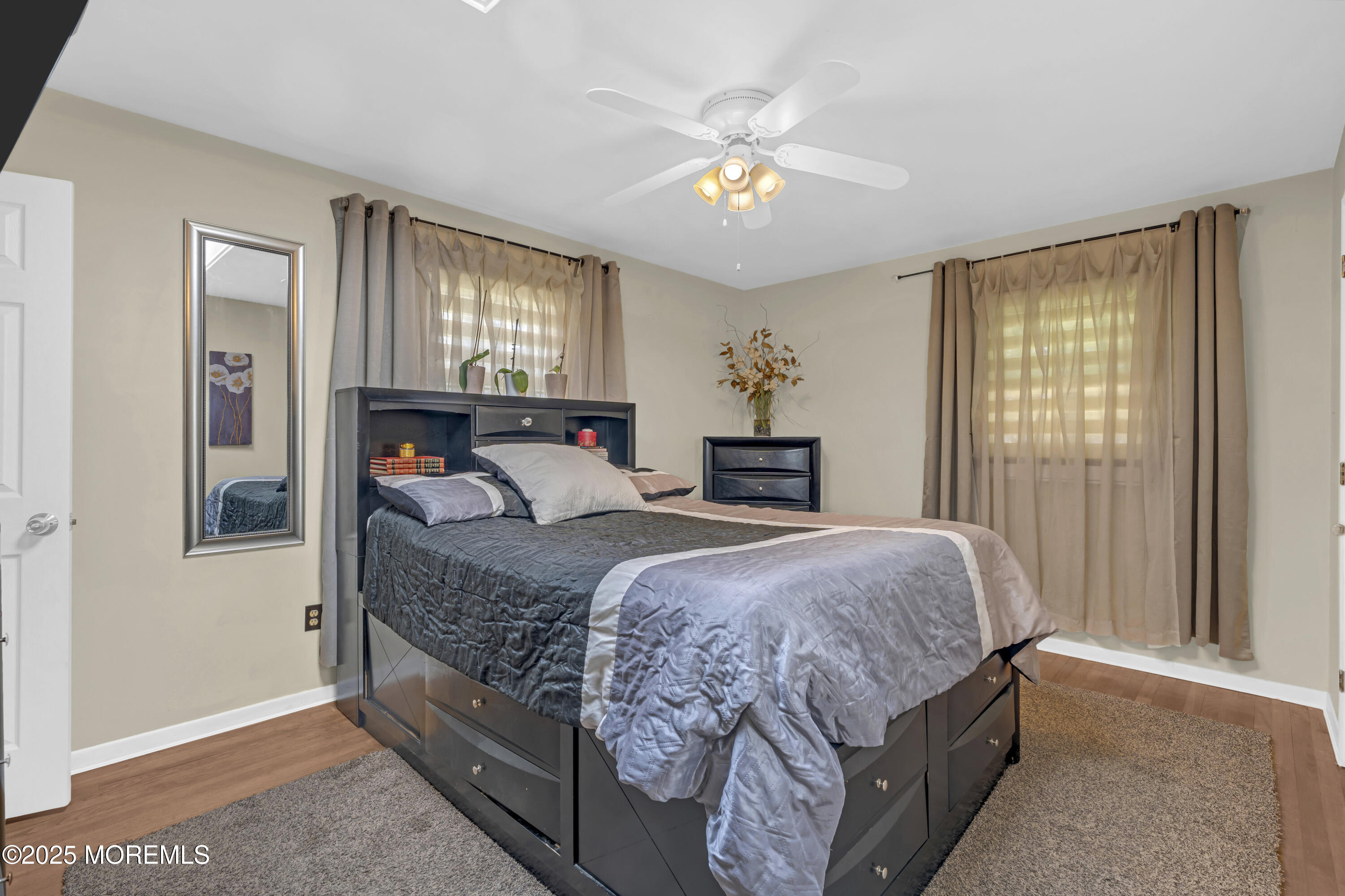13 Mountview Road Morris Plains, NJ 07950 - Photo 28 of 59 a bed room with a bed and a chandelier