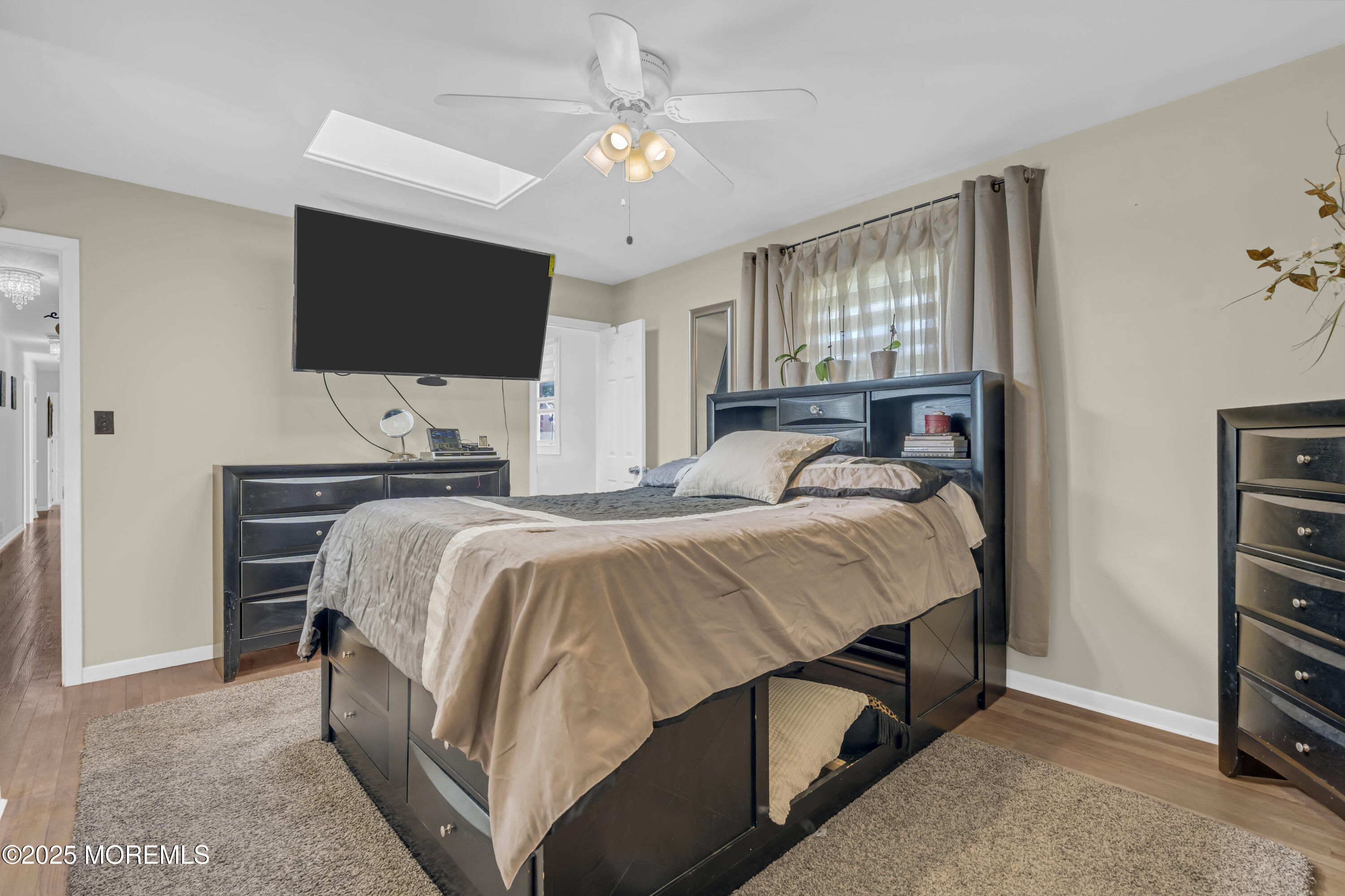 13 Mountview Road Morris Plains, NJ 07950 - Photo 31 of 59 a bedroom with a bed and a flat screen tv