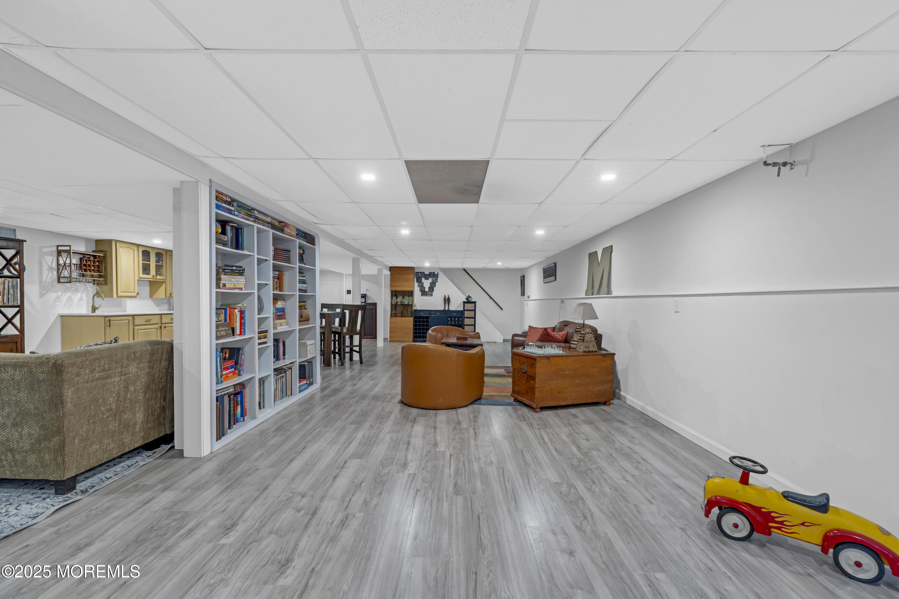 13 Mountview Road Morris Plains, NJ 07950 - Photo 37 of 59 a room with wooden floor and furniture