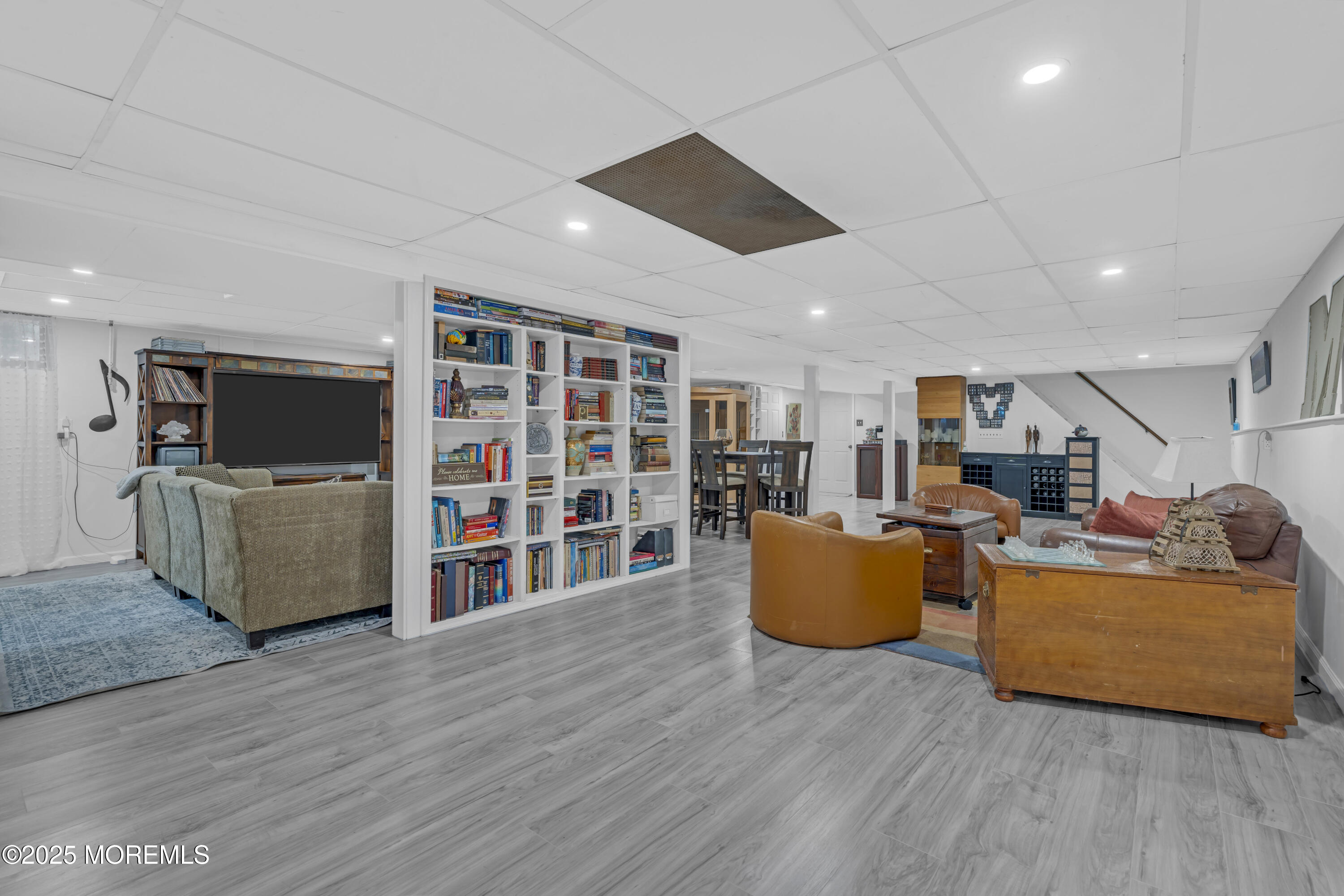 13 Mountview Road Morris Plains, NJ 07950 - Photo 38 of 59 a living room with furniture and a flat screen tv