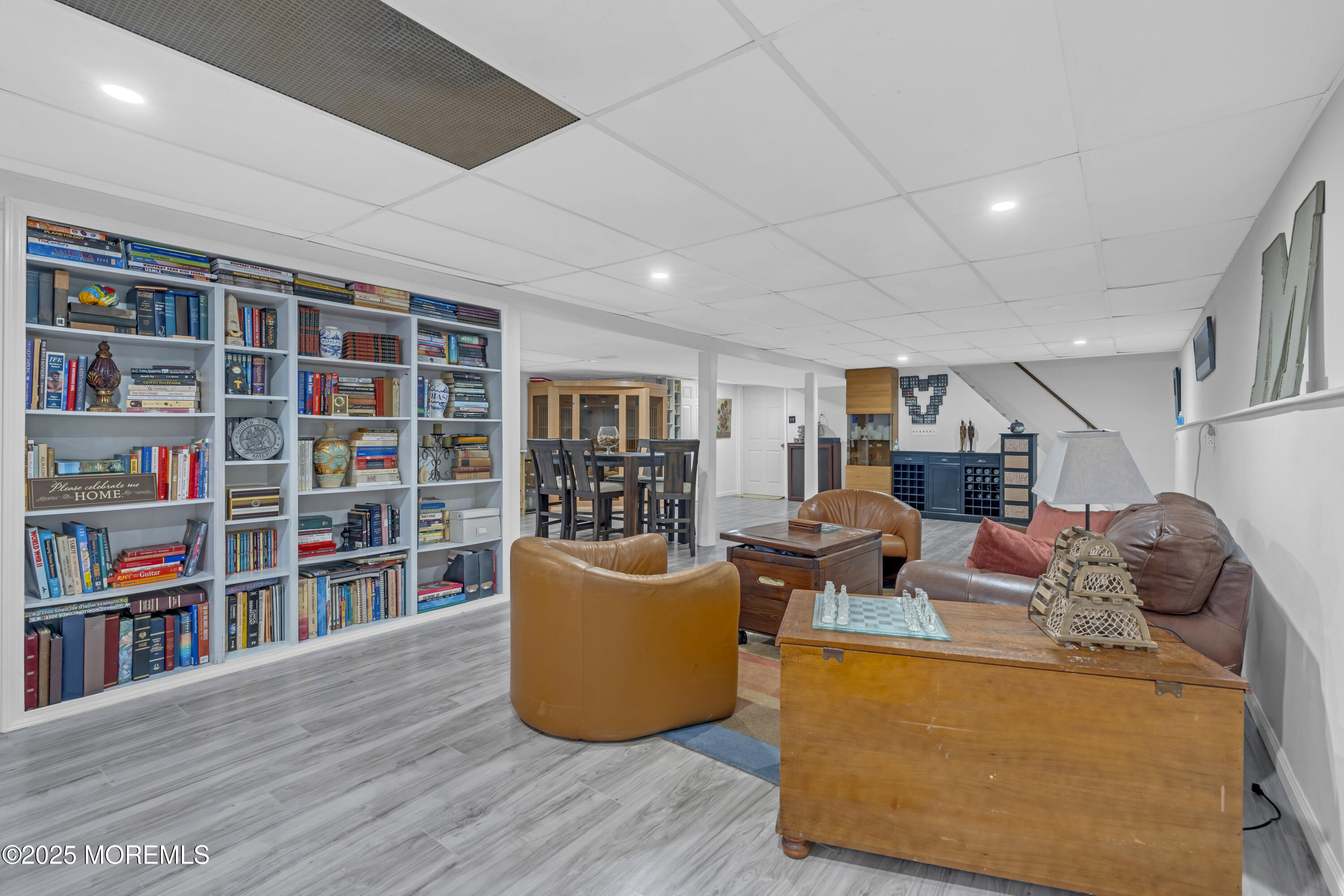13 Mountview Road Morris Plains, NJ 07950 - Photo 39 of 59 a living room with furniture and a book shelf