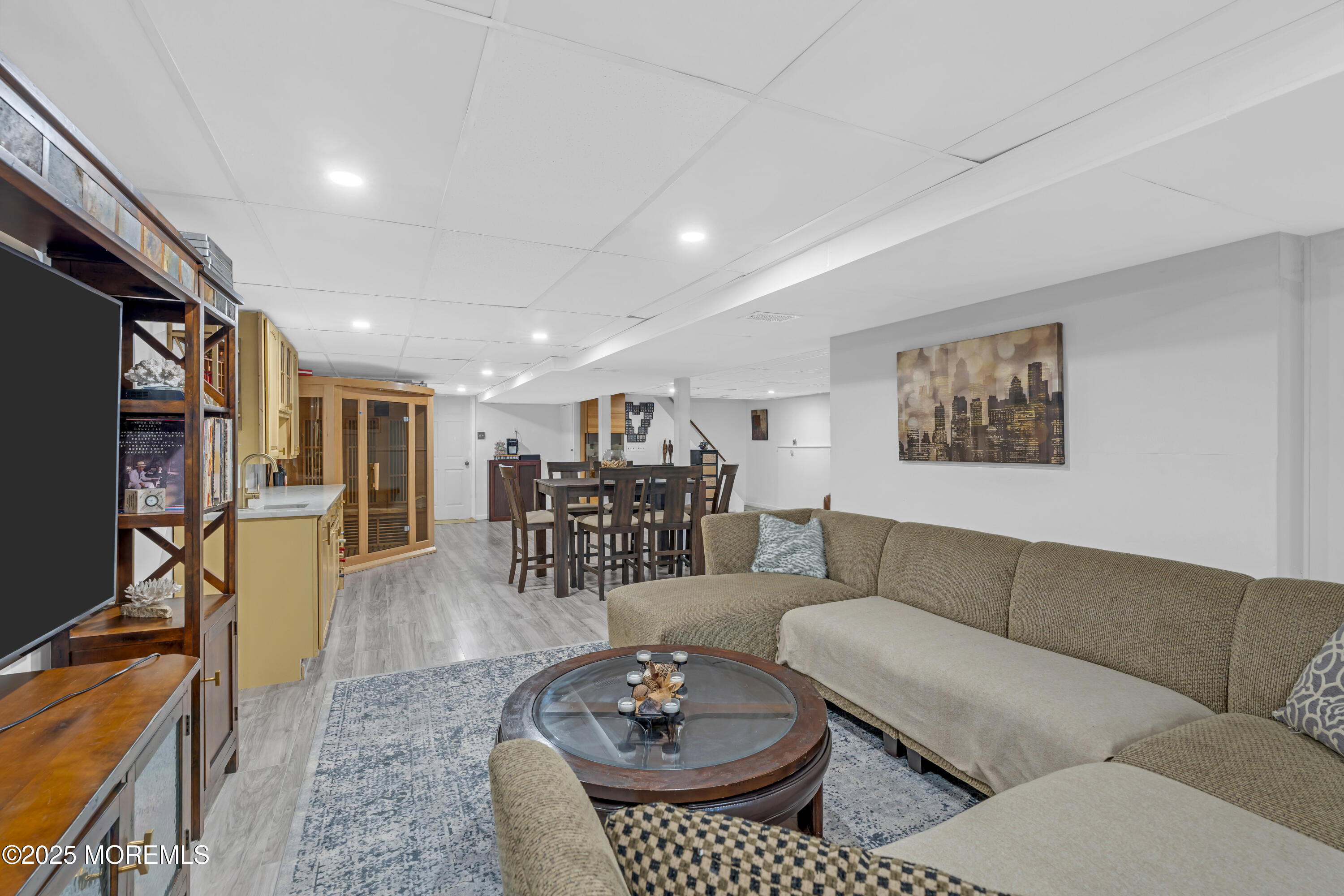 13 Mountview Road Morris Plains, NJ 07950 - Photo 41 of 59 a living room with furniture a rug and a flat screen tv