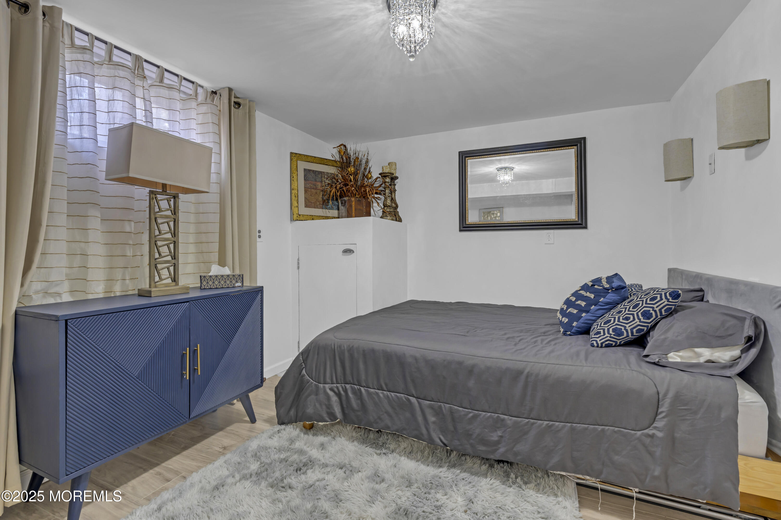 13 Mountview Road Morris Plains, NJ 07950 - Photo 44 of 59 a bedroom with a bed and painting on the wall