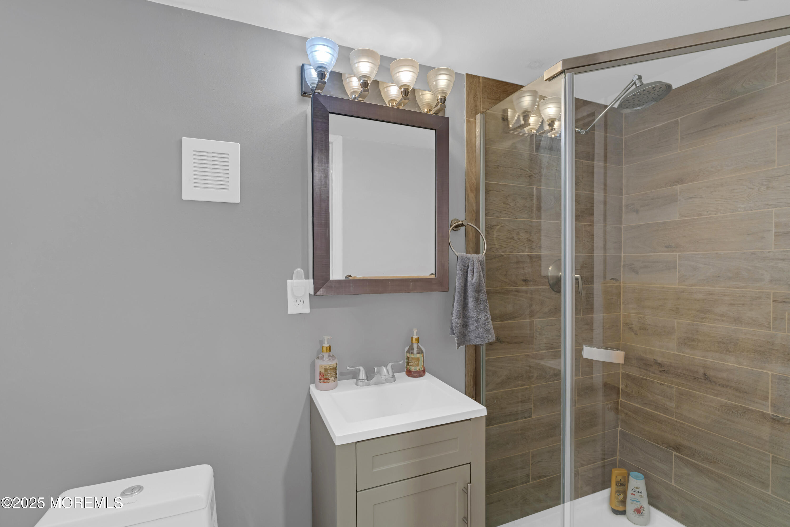 13 Mountview Road Morris Plains, NJ 07950 - Photo 45 of 59 a bathroom with a sink a toilet and shower