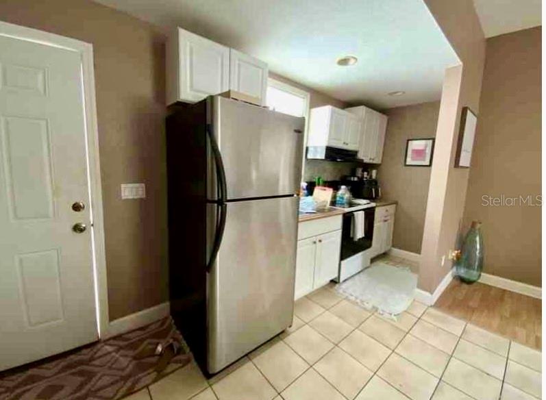 2322 West Cherry Street Tampa, FL 33607 - Photo 20 of 31 a kitchen with stainless steel appliances granite countertop a refrigerator and a sink