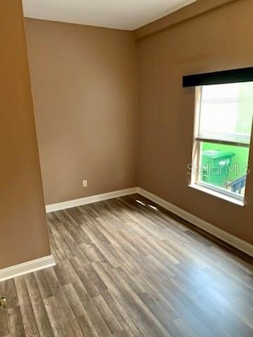 2322 West Cherry Street Tampa, FL 33607 - Photo 23 of 31 a view of empty room with wooden floor and fan