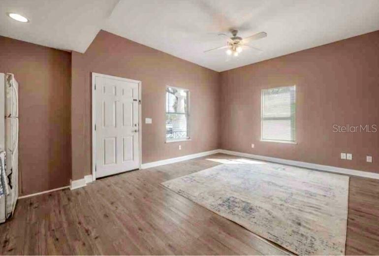 2322 West Cherry Street Tampa, FL 33607 - Photo 9 of 31 an empty room with windows and ceiling fan