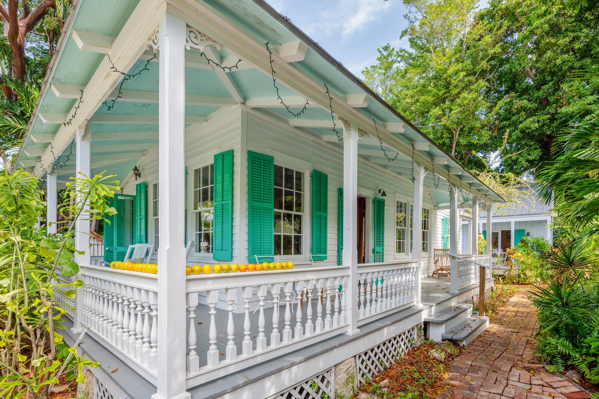 623 Catholic Lane Key West, FL 33040 - Photo 2 of 29 a view of a house with porch and wooden fence