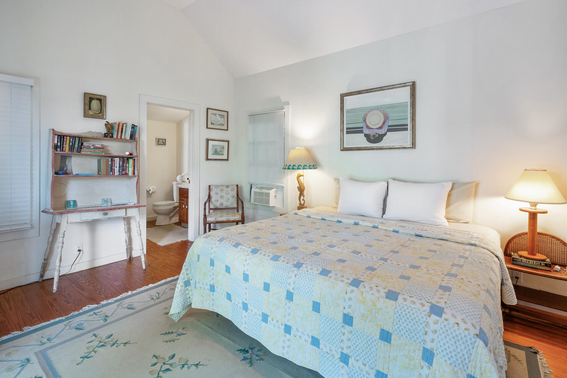 623 Catholic Lane Key West, FL 33040 - Photo 24 of 29 a bedroom with a bed and wooden floor