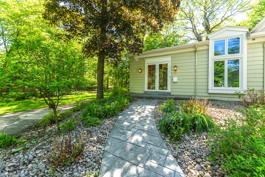 220 Hibiscus Drive Rochester, NY 14618 - Photo 2 of 50 Follow the front walkway to dramatic double doors and enter a home where architecture becomes art.