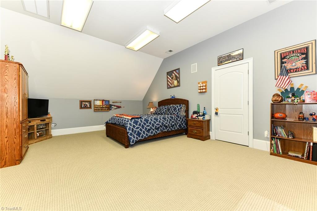 6021 Beckenham Way Oak Ridge, NC 27310 - Photo 23 of 44 Separate tub and shower and walk in closet.