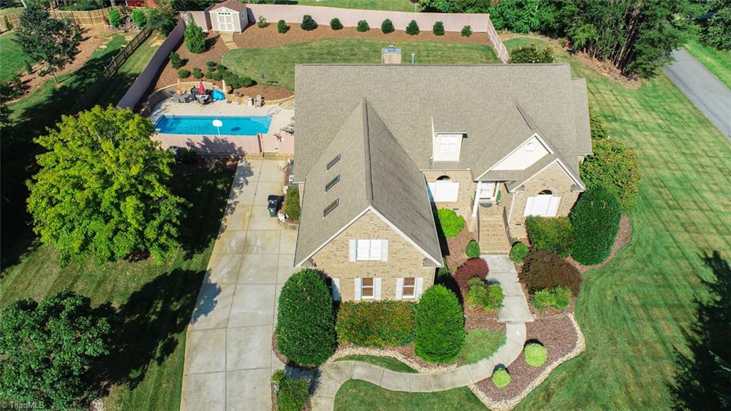 6021 Beckenham Way Oak Ridge, NC 27310 - Photo 4 of 44 Large corner lot with a privacy fence and SALTWATER pool! Fun for gatherings of friends and family!