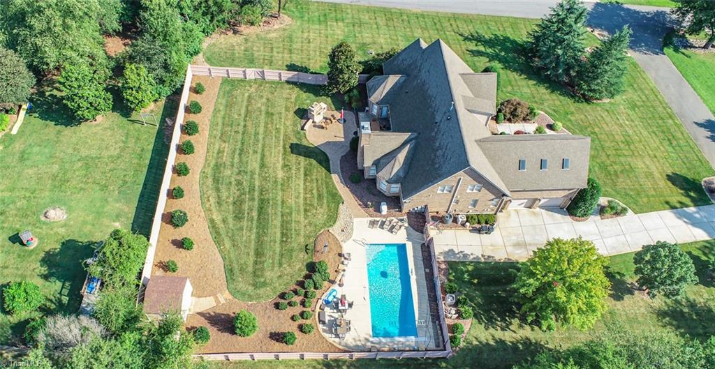 6021 Beckenham Way Oak Ridge, NC 27310 - Photo 6 of 44 Professional landscaping and a GENERAC generator installed in 2020.