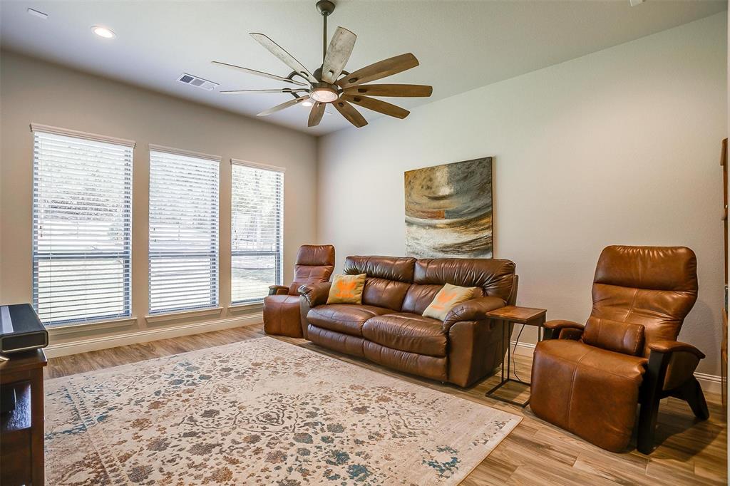 409 Glade Crest Road Azle, TX 76020 - Photo 19 of 31 a living room with furniture and a window