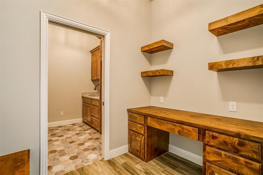 409 Glade Crest Road Azle, TX 76020 - Photo 25 of 31 a room with storage and utility