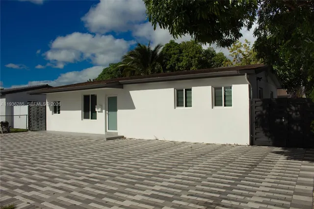 a house with trees in the background