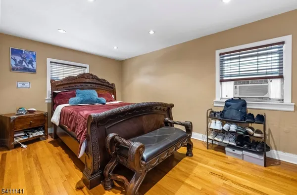 a bed room with a bed and a chair