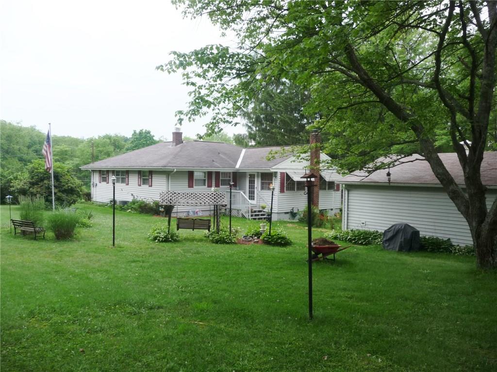 277 Kaufman Road Gibsonia, PA 15044 - Photo 23 of 25 Rear view of home and garage. Large level area toward rear.