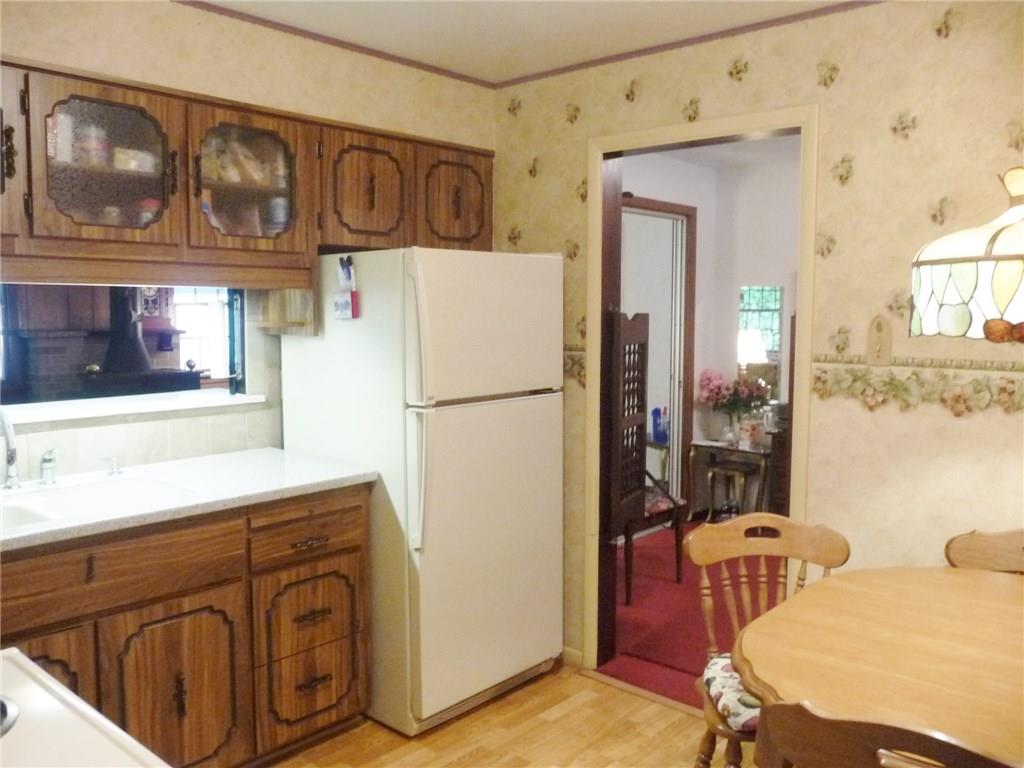 277 Kaufman Road Gibsonia, PA 15044 - Photo 7 of 25 There is a breakfast nook in the kitchen of possible added cabinet space if desired.