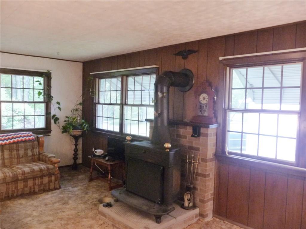 277 Kaufman Road Gibsonia, PA 15044 - Photo 8 of 25 Rear family has lots of windows and a wood stove for warm winter gatherings. This room has carpeted floor with plywood sub floor.