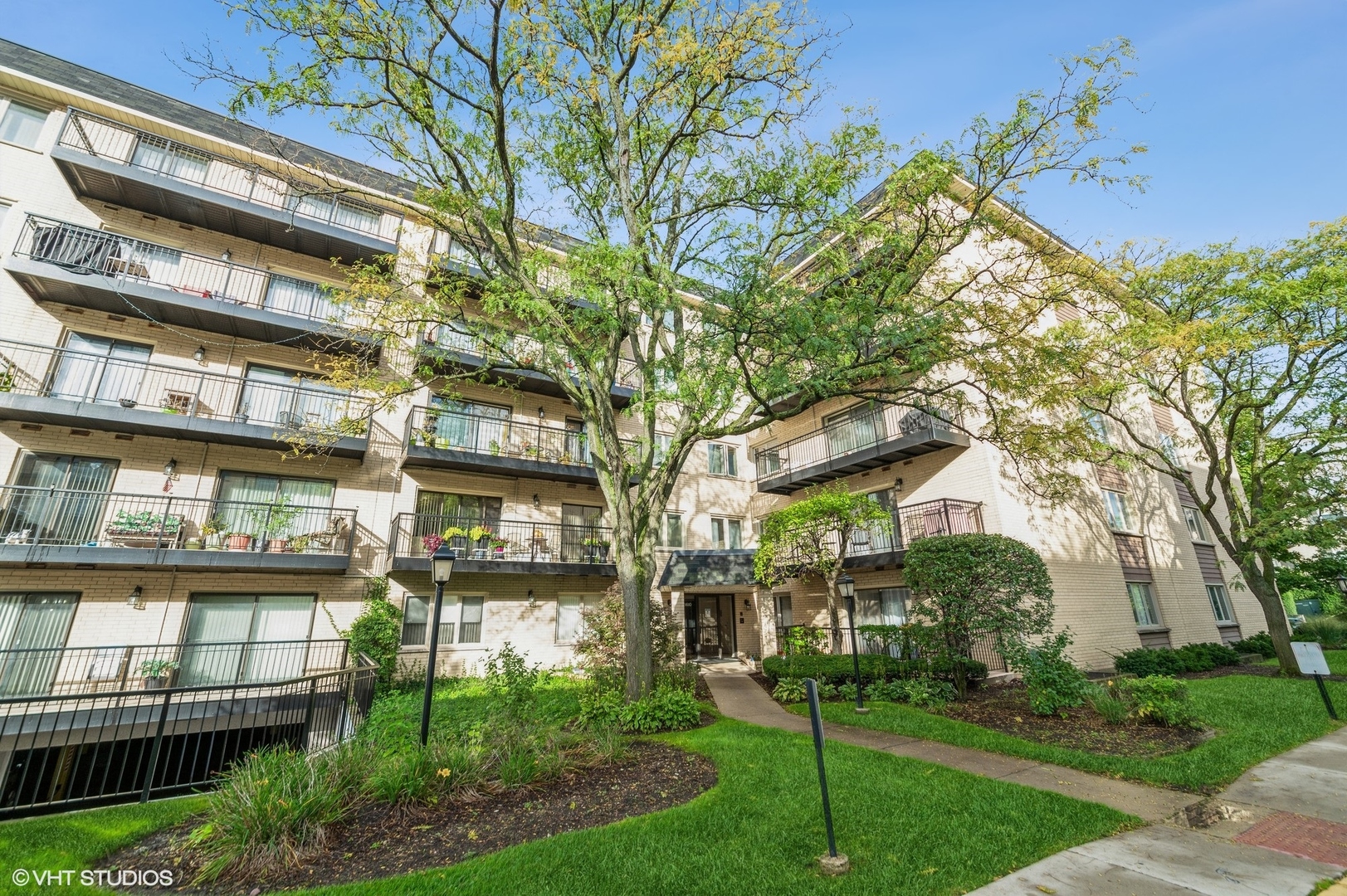 8610 Waukegan Road, Unit 306 Morton Grove, IL 60053 - Photo 1 of 13 a view of a building with a yard