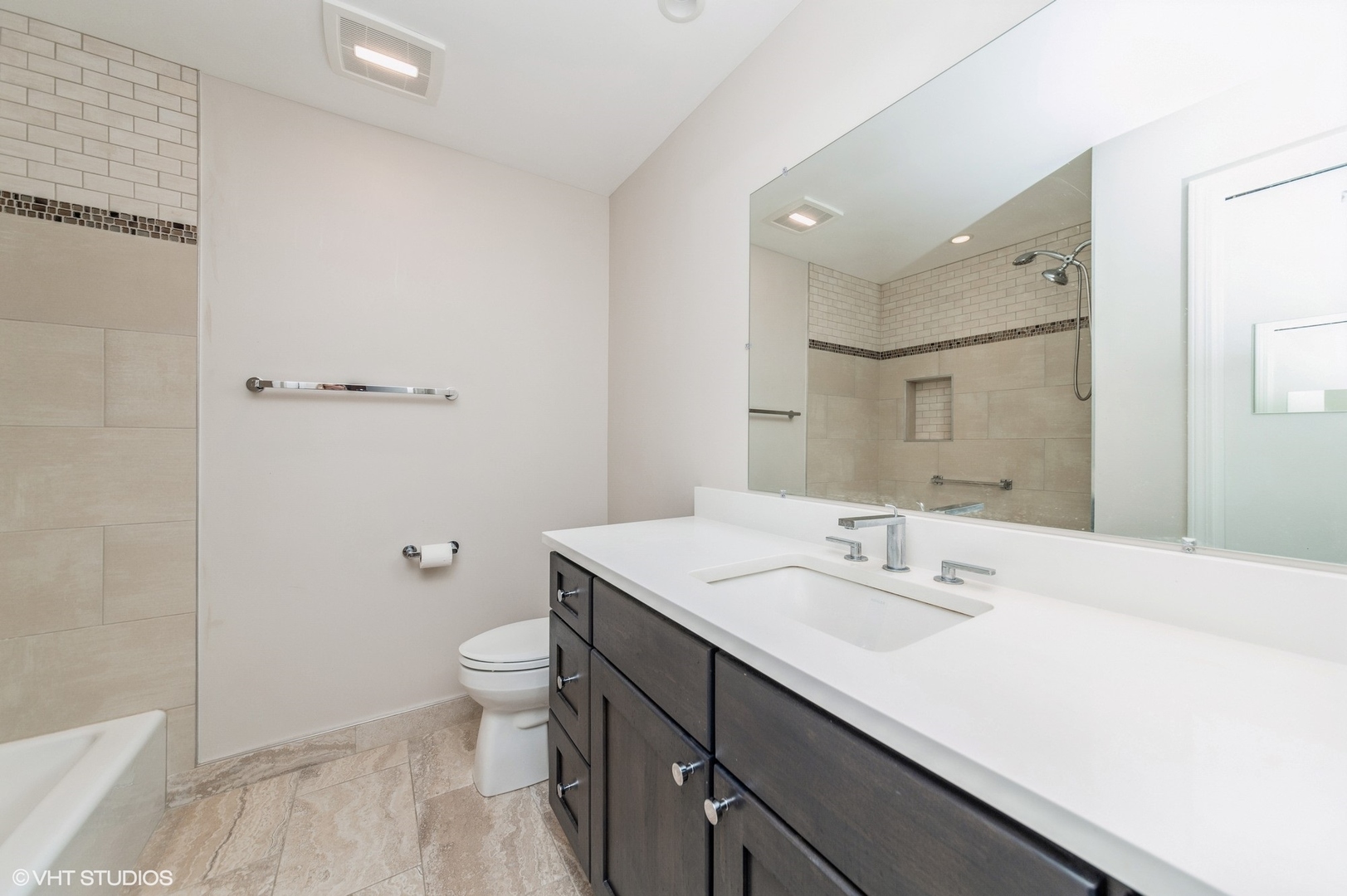 8610 Waukegan Road, Unit 306 Morton Grove, IL 60053 - Photo 5 of 13 a bathroom with a sink a toilet a shower and a mirror