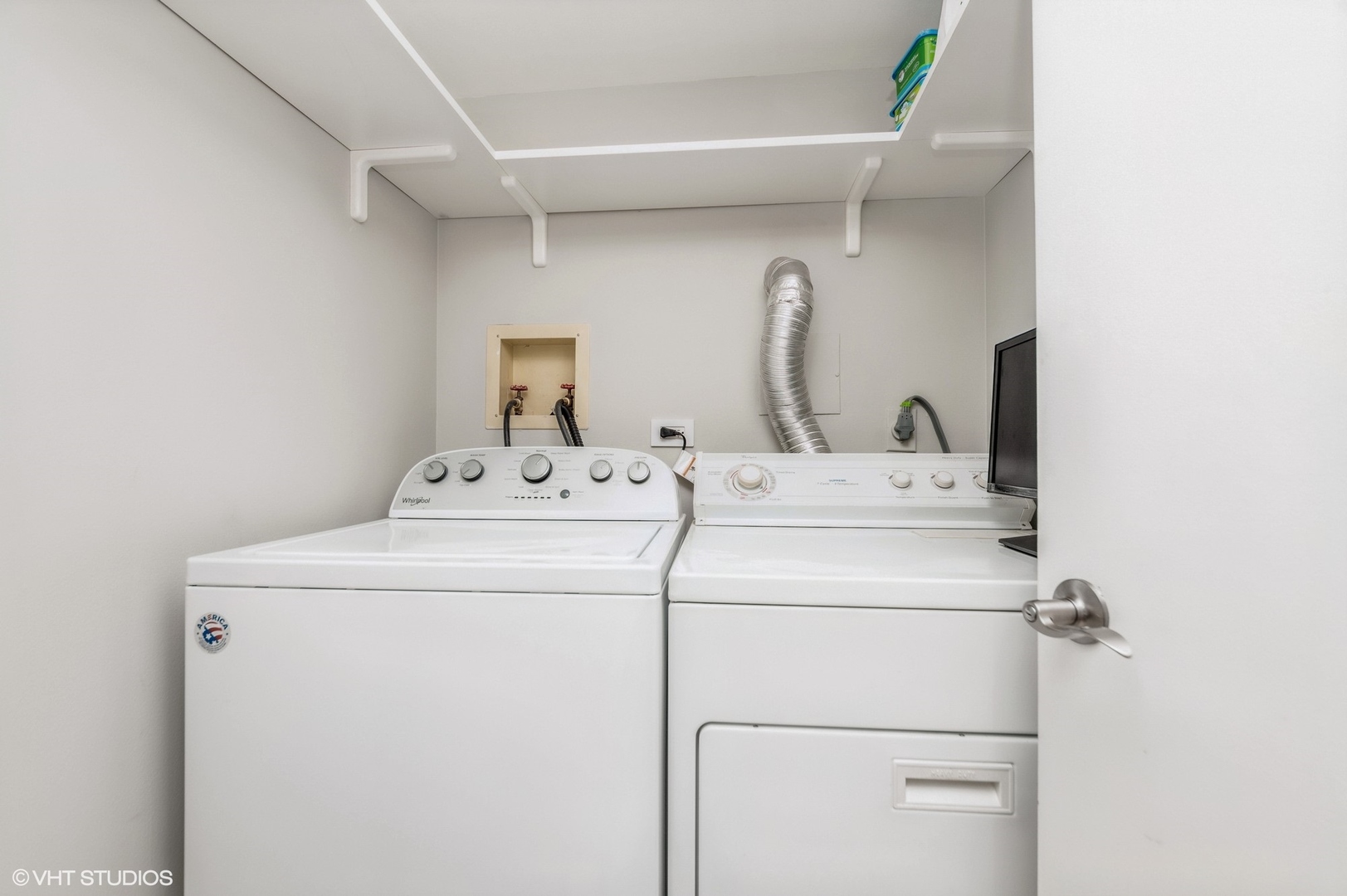 8610 Waukegan Road, Unit 306 Morton Grove, IL 60053 - Photo 9 of 13 a utility room with dryer and washer