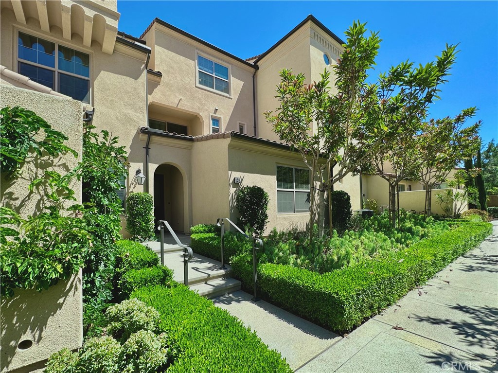 129 Briarberry Irvine, CA 92618 - Photo 1 of 26 a front view of a house with garden
