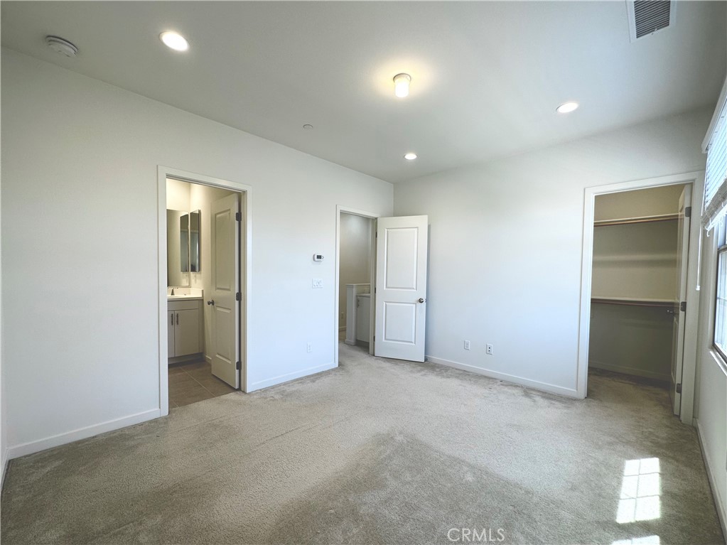 129 Briarberry Irvine, CA 92618 - Photo 17 of 26 an empty room with closet and a bathroom