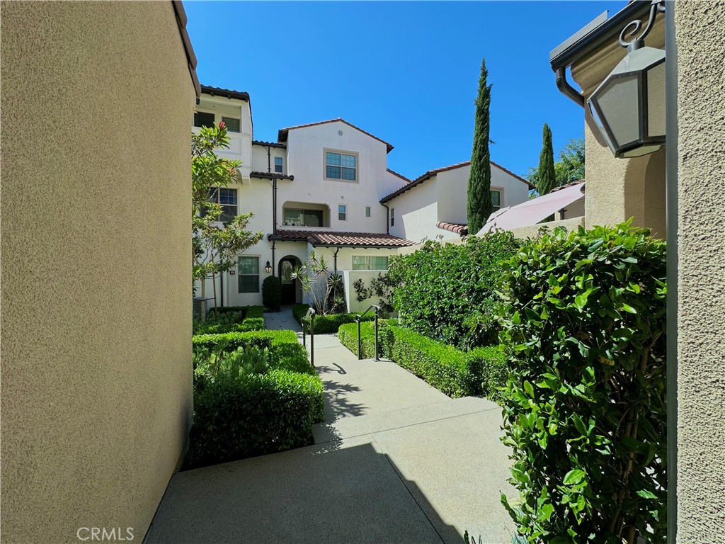 129 Briarberry Irvine, CA 92618 - Photo 3 of 26 a front view of a house with a yard