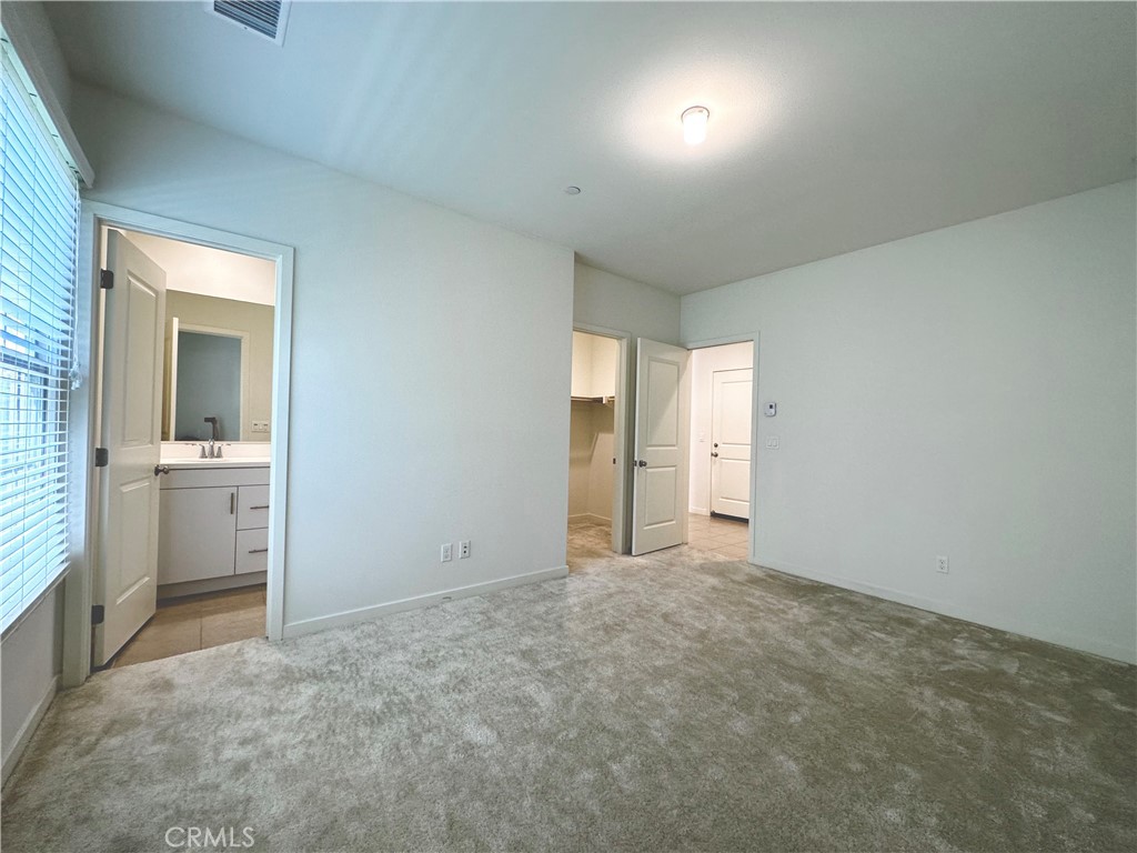 129 Briarberry Irvine, CA 92618 - Photo 5 of 26 a view of an empty room with a kitchen