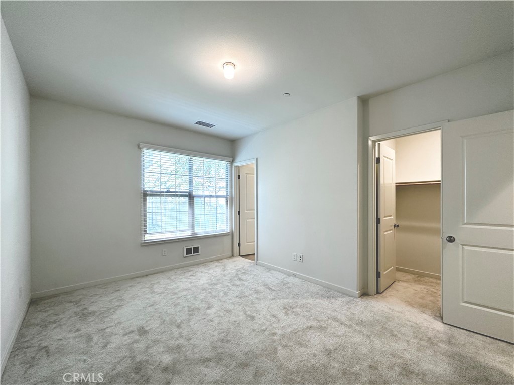 129 Briarberry Irvine, CA 92618 - Photo 6 of 26 an empty room with windows and closet