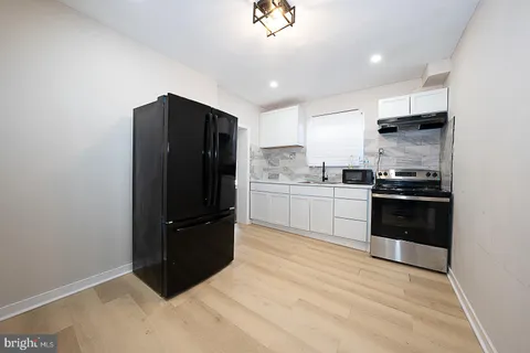 a bedroom with furniture and a flat screen tv