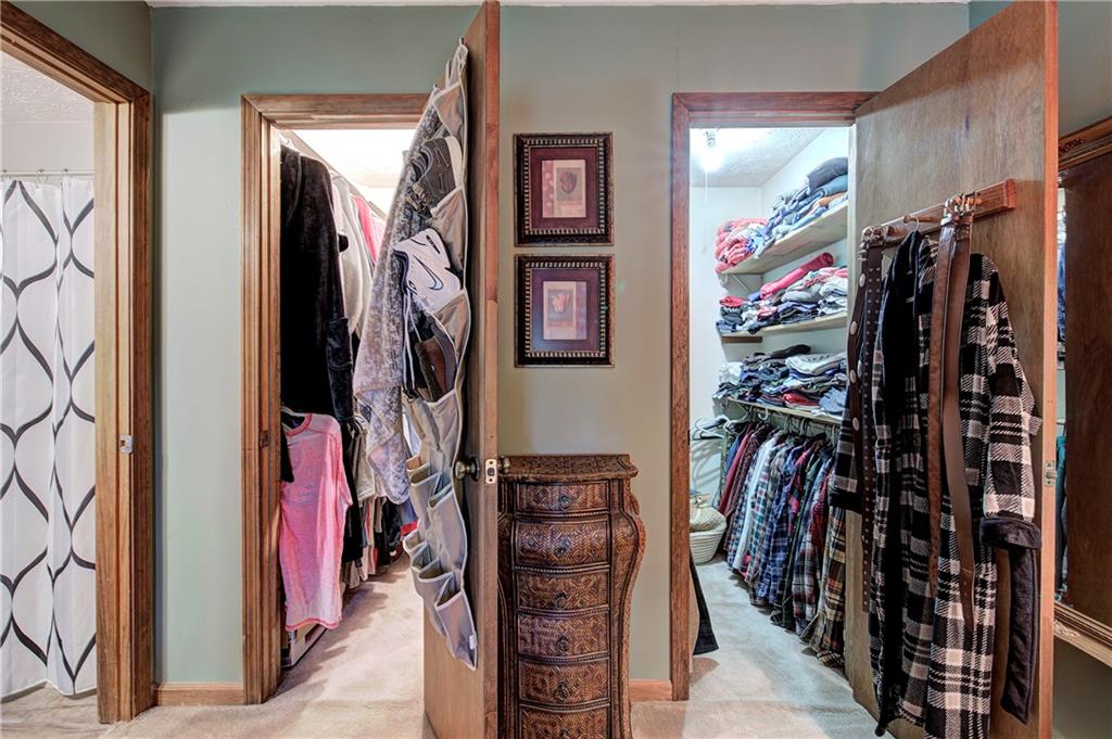 3637 Nebo Road Hiram, GA 30141 - Photo 36 of 63 a view of walk in closet with clothes