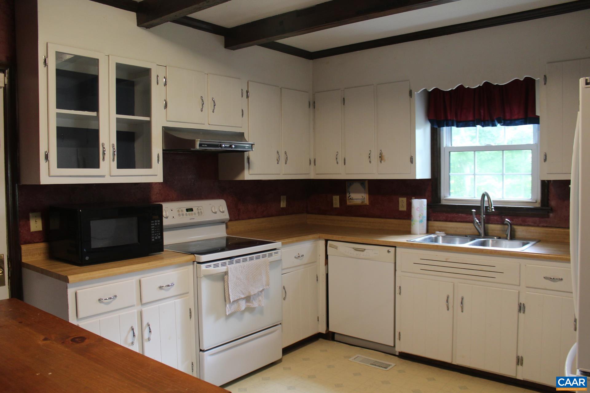 3456 South Constitution Route Dillwyn, VA 23936 - Photo 36 of 38 a kitchen with white cabinets and sink