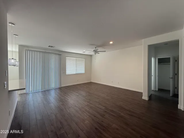 an empty room with wooden floor
