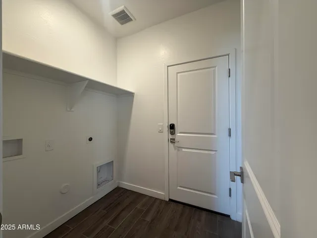 an empty room with a empty space and windows