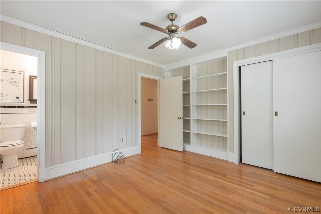 8401 Halesworth Road Richmond, VA 23235 - Photo 13 of 50 a view of an empty room with a window and wooden floor