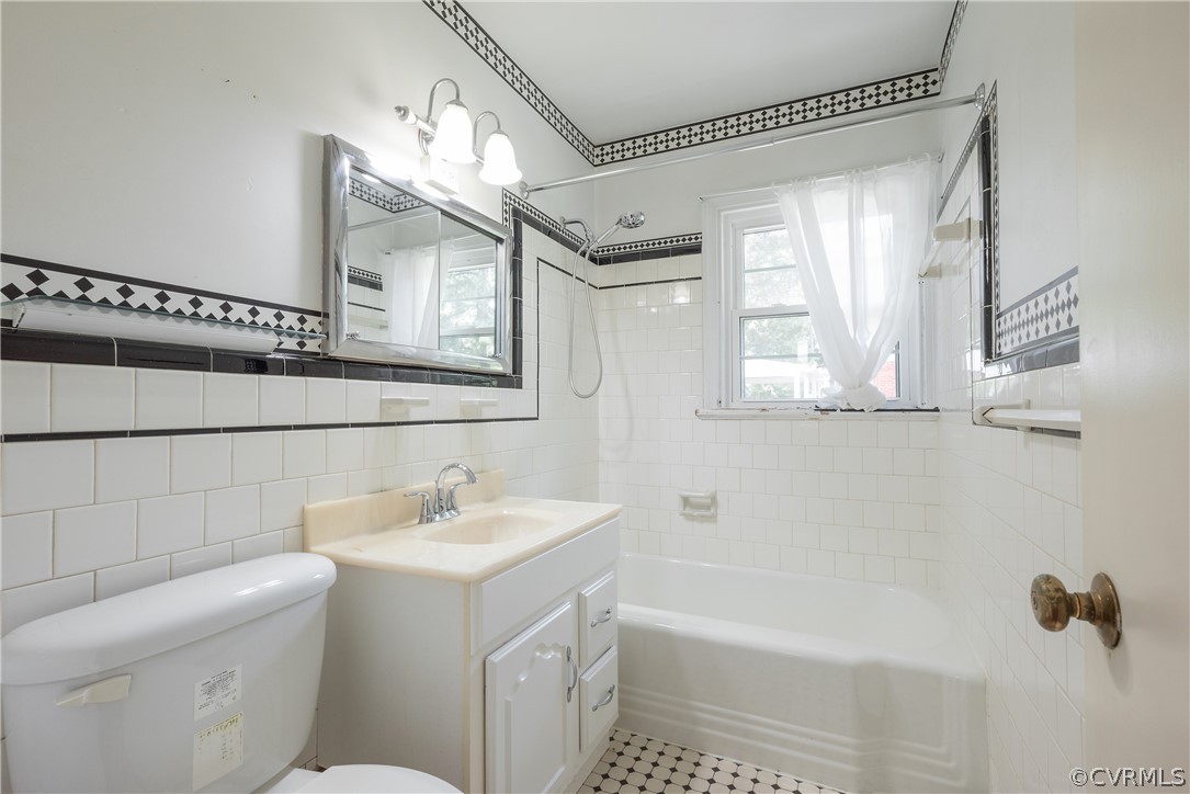 8401 Halesworth Road Richmond, VA 23235 - Photo 20 of 50 a bathroom with a sink a toilet and a mirror