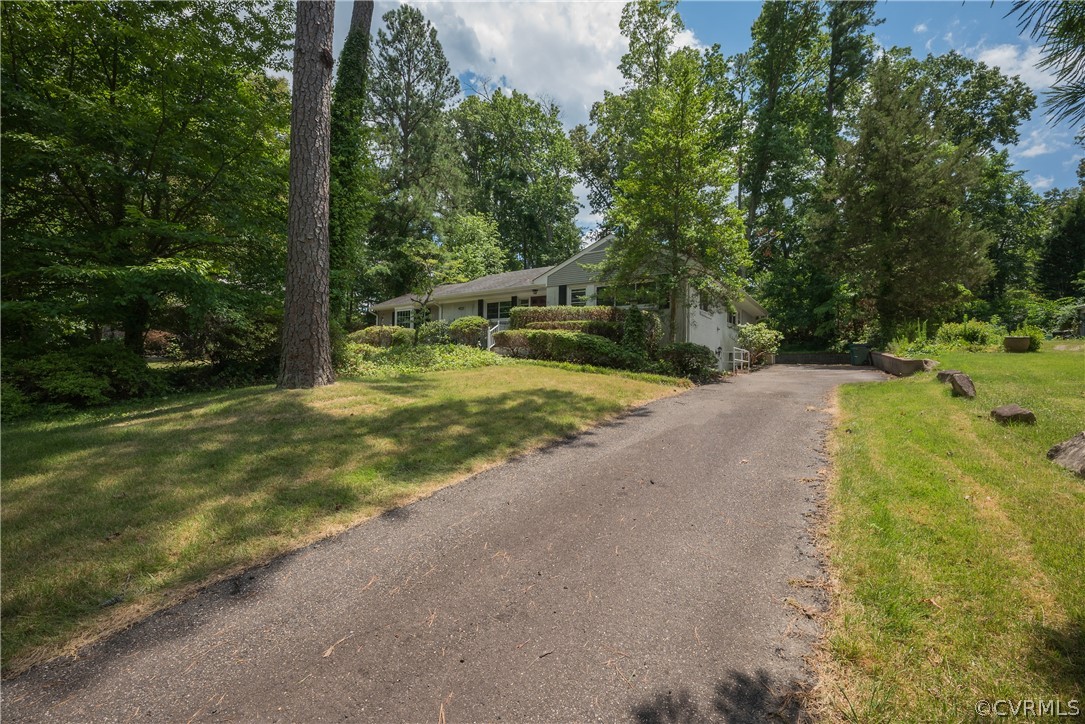 8401 Halesworth Road Richmond, VA 23235 - Photo 2 of 50 a view of a yard with plants