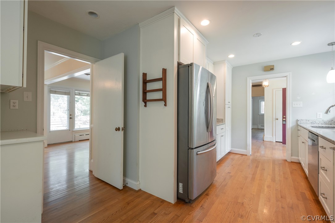 8401 Halesworth Road Richmond, VA 23235 - Photo 26 of 50 a view of a kitchen with a refrigerator and wooden floor