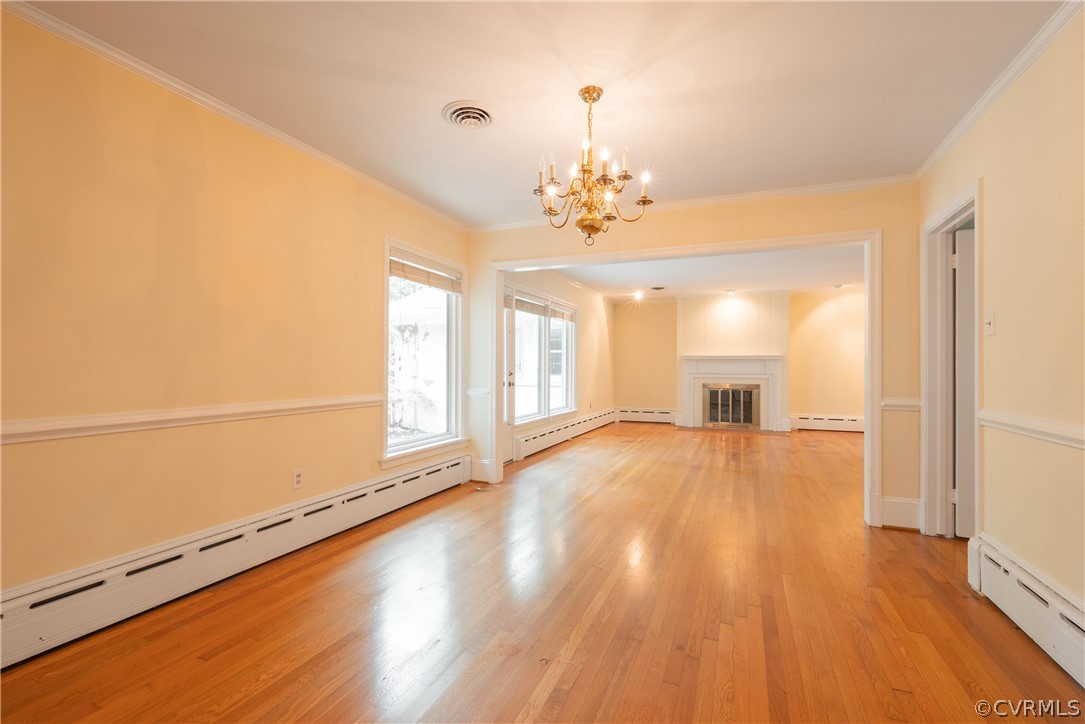 8401 Halesworth Road Richmond, VA 23235 - Photo 36 of 50 a view of empty room with wooden floor and fan