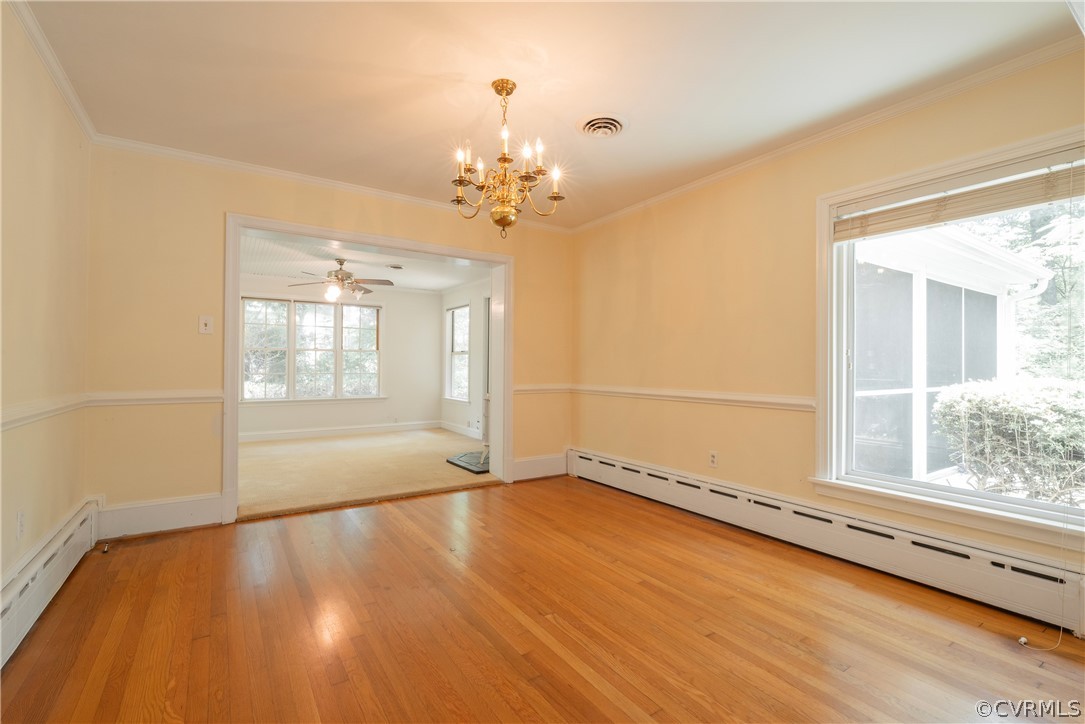 8401 Halesworth Road Richmond, VA 23235 - Photo 37 of 50 a view of an empty room with a window and wooden floor